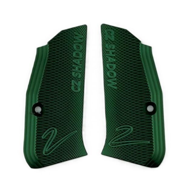 Two textured, dark green GRIPS GREEN SHADOW 2 COMPACT for the CZ Shadow Compact, each with diagonal and wavy lines, a screw hole, and "CZ SHADOW" engraved above a stylized "Z" at the bottom.